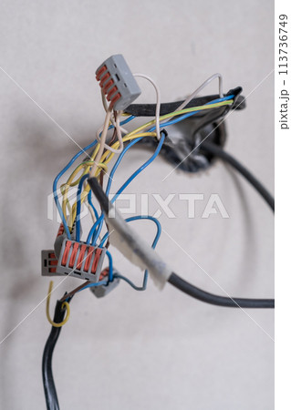 Apartment renovation. Electrical wiring. Wires sticking out of the wall. 113736749