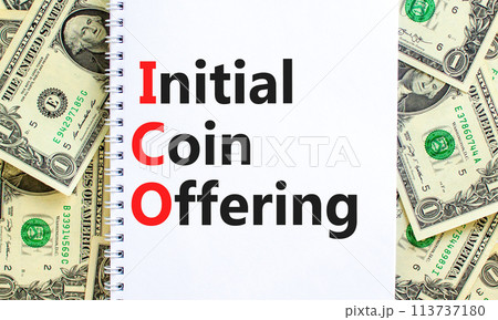 ICO initial coin offering symbol. Concept words ICO initial coin offering on beautiful white note. Beautiful dollar bills background. Business ICO initial coin offering concept. Copy space. ICO initial coin offering symbol. Concept words ICO initial coin offering on beautiful white note. Beautiful dollar bills background. Business ICO initial coin offering concept. Copy space. 113737180
