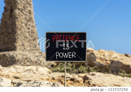 Patience is power symbol. Concept words Patience is power on beautiful black chalk blackboard. Beautiful red stone blue sky background. Business and patience is power concept. Copy space. 113737250