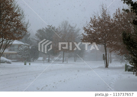 There are road covered with snow near apartment blocks during winter 113737657