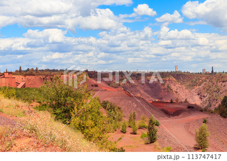 View of huge iron ore quarry in Kryvyi Rih, Ukraine. Open pit mining 113747417