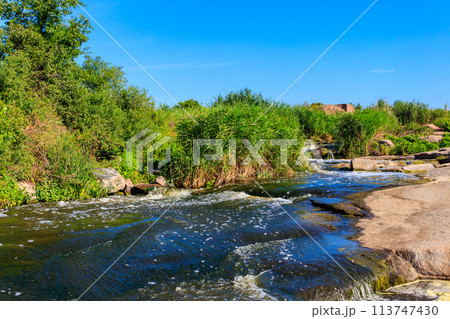 View of Tokovsky waterfalls on the Kamenka river in Dnipropetrovsk region, Ukraine 113747430