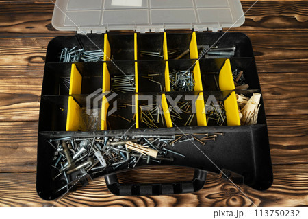 Toolbox Filled With Screws and Nails 113750232