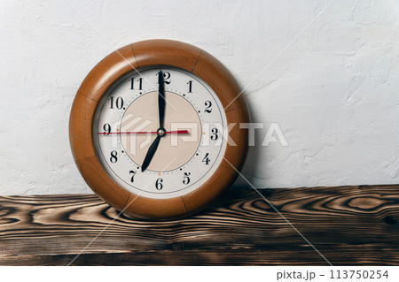 clock with hands showing the time 7-00, seven o'clock, time to get up for work clock with hands showing the time 7-00, seven o'clock, time to get up for work 113750254