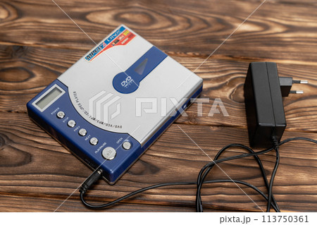 CD player or DVD player on a wooden background. control buttons. Power unit CD player or DVD player on a wooden background. control buttons. Power unit 113750361