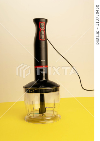 A kitchen blender with a cord attached to it, ready for use in preparing food or drinks A kitchen blender with a cord attached to it, ready for use in preparing food or drinks 113750450