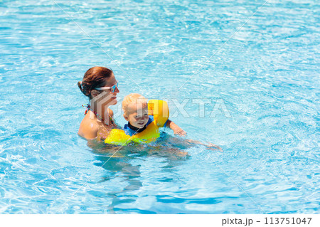 Mother and baby in swimming pool Mother and baby in swimming pool 113751047
