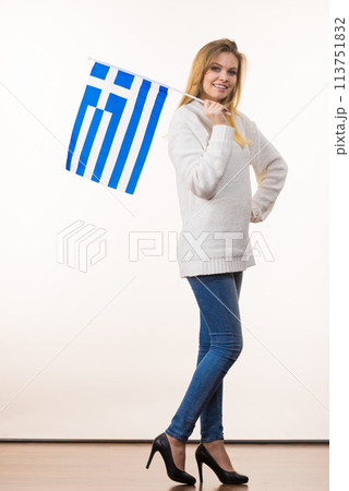 Happy woman holding Greek national flag Happy woman holding Greek national flag 113751832