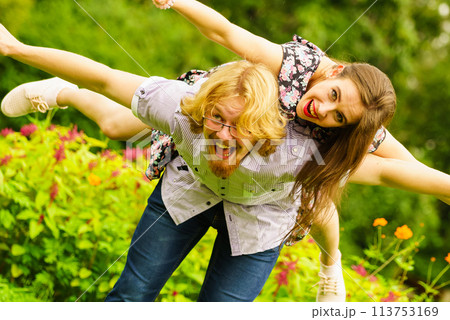 Happy couple playing in park 113753169