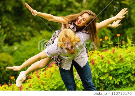 Happy couple playing in park 113753170
