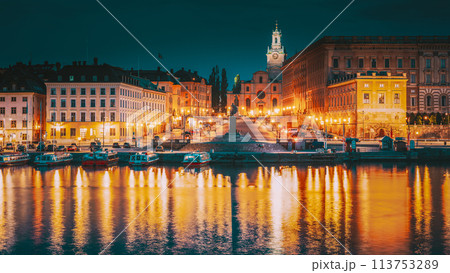 Stockholm, Sweden. Scenic Famous View Of Embankment In Old Town Of Stockholm In Night Lights. Great Church Or Church Of St. Nicholas And Royal Palace. Famous Popular Destination Scenic Place In Light Stockholm, Sweden. Scenic Famous View Of Embankment In Old Town Of Stockholm In Night Lights. Great Church Or Church Of St. Nicholas And Royal Palace. Famous Popular Destination Scenic Place In Light 113753289