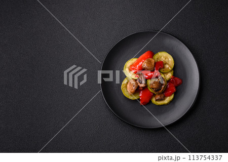 Delicious fresh grilled vegetables zucchini, bell peppers, mushrooms and onions 113754337
