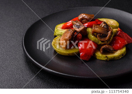 Delicious fresh grilled vegetables zucchini, bell peppers, mushrooms and onions 113754340
