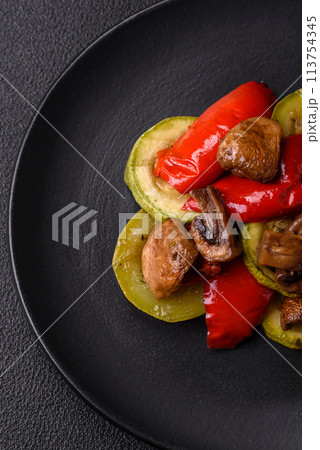 Delicious fresh grilled vegetables zucchini, bell peppers, mushrooms and onions 113754345
