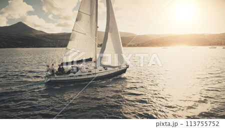 Brodick Harbour, Arran Island, Scotland. Luxury yacht travel at sun shine sea bay aerial. Sailing on motor boat in wind at ocean harbor. Amazing nature seascape at summer. Marine vacation 113755752