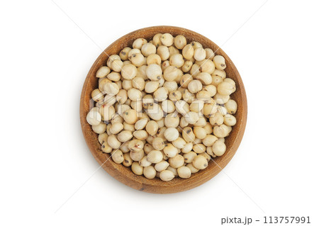 Sorghum seeds in wooden bowl isolated on white background. Top view. Flat lay. Sorghum seeds in wooden bowl isolated on white background. Top view. Flat lay. 113757991