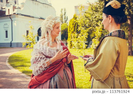Portrait of two woman dressed in historical Baroque clothes Portrait of two woman dressed in historical Baroque clothes 113761924