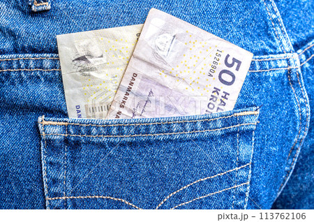 Danish kronor banknotes sticking out of the jeans pocket Danish kronor banknotes sticking out of the jeans pocket 113762106