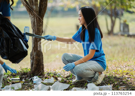 Group of volunteers, community members cleaning the nature from garbage and plastic waste to send it for recycling Group of volunteers, community members cleaning the nature from garbage and plastic waste to send it for recycling 113763254