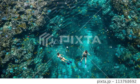 Two people swimming in the sea full of plastic waste 113768692