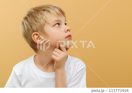 Blonde boy . Let me think . Thoughtful clever 113771916