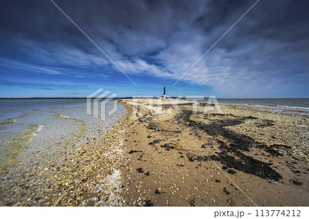Pebble beach at the Sorve Lighthouse in Saaremma, Estonia 113774212