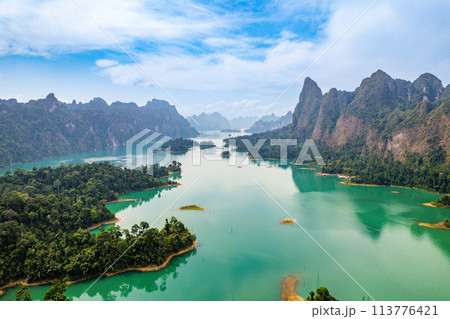 Aerial view of Khao Sok national park, in Cheow lan lake, Surat Thani, Thailand Aerial view of Khao Sok national park, in Cheow lan lake, Surat Thani, Thailand 113776421