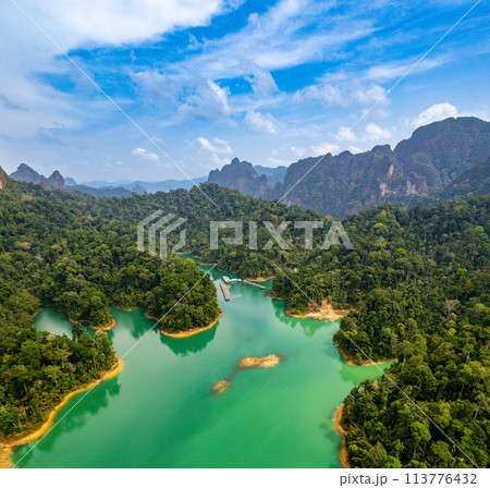 Aerial view of Khao Sok national park, in Cheow lan lake, Surat Thani, Thailand Aerial view of Khao Sok national park, in Cheow lan lake, Surat Thani, Thailand 113776432