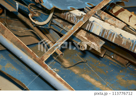 A pile of old scrap iron. Angles, pipes, slats, planks 113776712