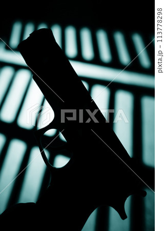 Pistol gun dark at night Pistol gun dark at night 113778298