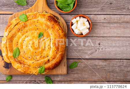 Traditional greek food . Baked spanakopita with feta and spinach 113778624