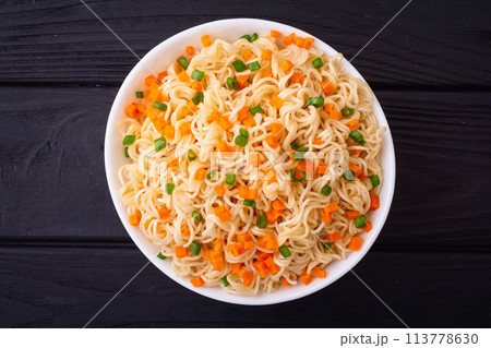 Instant noodles with carrot and green onion , traditional asian food 113778630