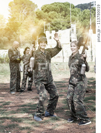 Portrait of satisfied man and woman paintball players delighted 113780019