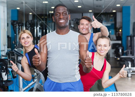 men and women during break in gym 113780028
