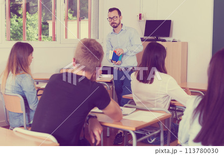 Teacher is giving lecture for students Teacher is giving lecture for students 113780030