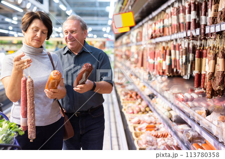 Elderly man and elderly woman choose sausage 113780358