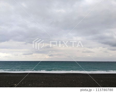 Hualien, Taiwan - 11.26.2022: Qixingtan Beach with no people facing the wavy Pacific Ocean on a stormy day under clouds during the pandemic 113780780