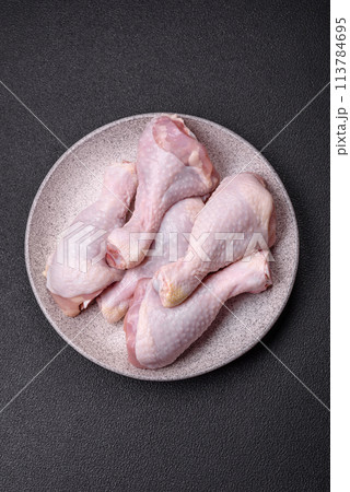 Fresh raw chicken legs with salt and spices Fresh raw chicken legs with salt and spices 113784695