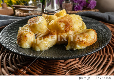 Homemade lazy noodles with cheese, crumbs and melted butter. 113785400