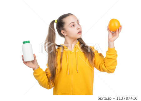 child choose between orange fruit and vitamin pill in jar bottle isolated on white, pill child choose between orange fruit and vitamin pill in jar bottle isolated on white, pill 113787410