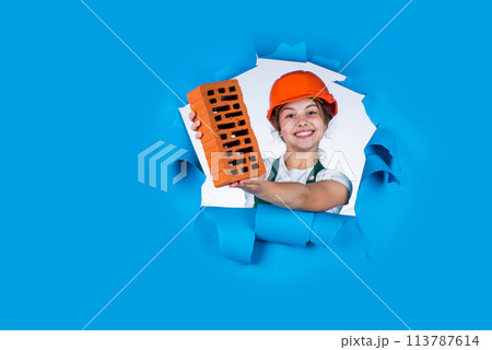 teen girl builder in protective helmet use brick, building teen girl builder in protective helmet use brick, building 113787614