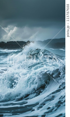 Waves crashing against the shore during a coastal storm, storm surge, high seas, dramatic weather conditions 113787688