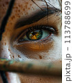 In individual sports, an archer's intense focus on the target involves a close-up of eyes, bow, tension, and precision 113788699