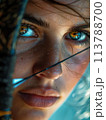 In individual sports, the archer's intense focus on the target, with a close-up on eyes and bow, emphasizes precision and tension 113788700
