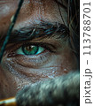 Individual sports focus, archer concentrating on target, close-up on eyes and bow, tension, precision 113788701