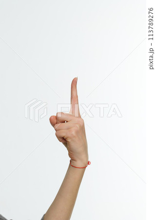 Female hand pointing up with finger number one 113789276