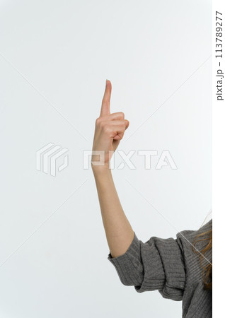 Female hand pointing up with finger number one Female hand pointing up with finger number one 113789277