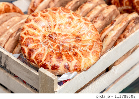 Traditional appetizing uzbek flatbreads from the tandyr 113789508