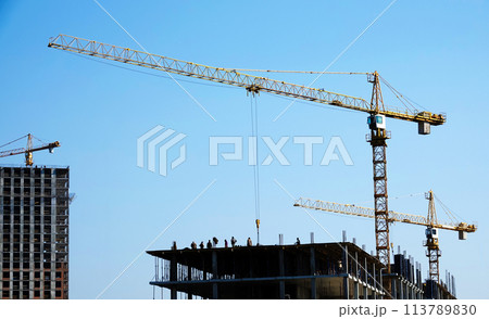Kiev, Ukraine January 19, 2021: Tower construction cranes on the construction of high-rise buildings 113789830