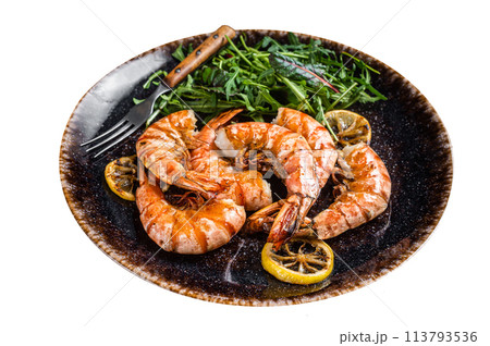 Spicy garlic Giant shrimps prawns in plate with salad. Isolated on white background. Top view. Spicy garlic Giant shrimps prawns in plate with salad. Isolated on white background. Top view. 113793536